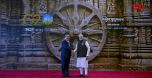 Chinese Premier Li Qiang shares a crisp handshake with PM Modi at the summit venue