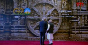 PM Modi shows the ancient 13th century Konark wheel to US President Joe Biden after greeting him at the venue