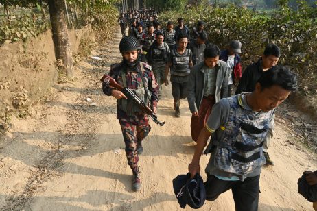 Border Guard Bangladesh (BGB) personnel detain Myanmar Border Guard Police (BGP) and security forces seeking refuge in Cox's Bazar district in Bangladesh, Feb. 6, 2024.