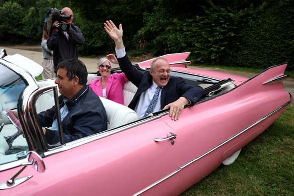 Liberal Democrats leader Ed Davey gestures next to deputy leader Daisy Cooper at a campaign event in Harpenden